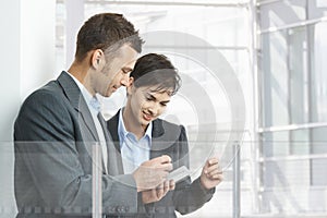 Businesspeople using smartphone