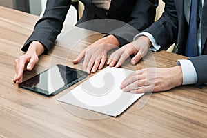 Businesspeople using tablet