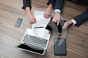 Businesspeople using tablet