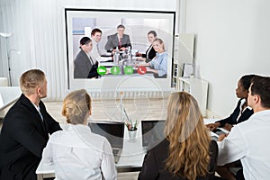 Businesspeople Videoconferencing At Workplace