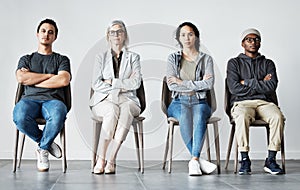 Businesspeople waiting in line for an interview. Patients sitting in line at doctors office. Therapist sitting with