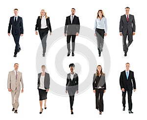 Businesspeople Walking Over White Background