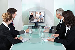 Businesspeople watching an online presentation