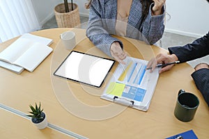 Businesspeople working with business documents and discussing new project in office desk.