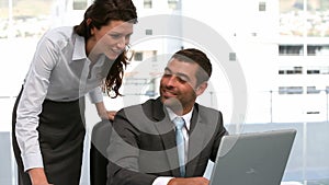 Businesspeople working on a computer