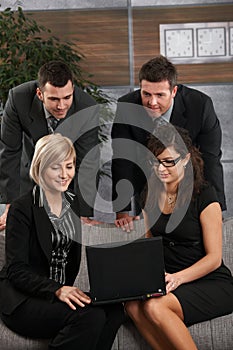 Businesspeople working with laptop