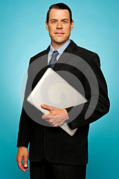 Businessperson carrying a laptop