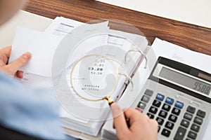 Businessperson examining receipts