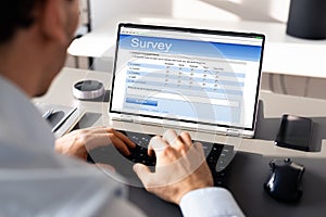 Businessperson Filling Online Survey Form