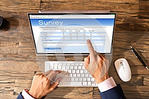 Businessperson Filling Online Survey Form