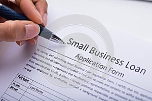 Businessperson Filling Small Business Loan Application Form