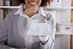 Businessperson Giving Cheque In Office photo