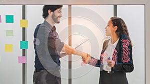 Businessperson having handshake after team brainstorming together