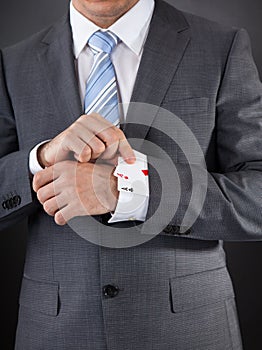 Businessperson Hiding Poker Card