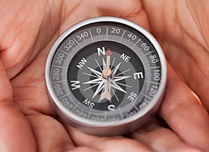 Businessperson Holding Compass