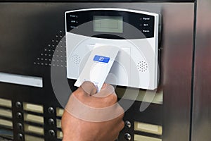 Businessperson Holding Keycard To Open Door