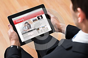Businessperson Reading News Online