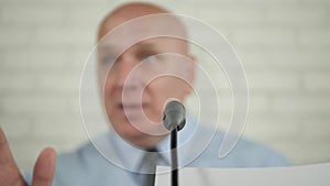 Businessperson Smile Pleased Talk and Gesticulate in a Press Conference