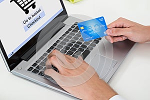 Businessperson Using Laptop And Credit Card