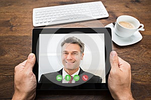 Businessperson Video Chatting With Colleague