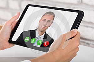 Businessperson Videoconferencing On Digital Tablet