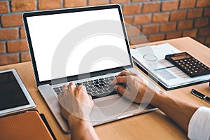 Businesss man using laptop with blank screen in the office