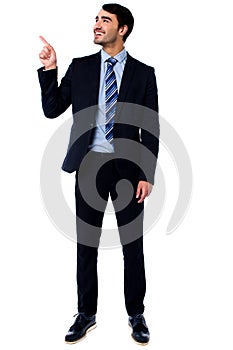 Businesssman looking and pointing upwards