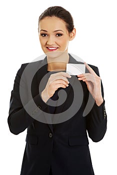 Businessswoman holding empty card.