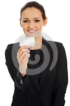 Businessswoman holding empty card.