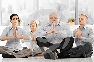 Businessteam doing yoga meditation