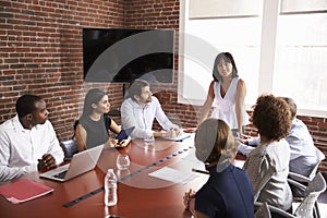 Businesswoman Addressing Boardroom Meeting