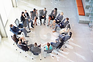 Businesswoman Addressing Multi-Cultural Office Staff Meeting