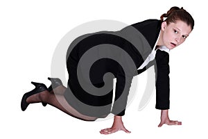 A businesswoman on all fours.