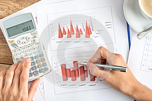 Businesswoman analysing statistical graphs photo