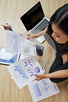 Businesswoman analyzing documents