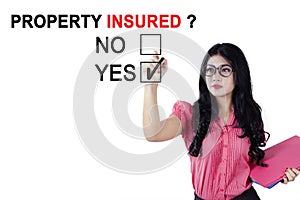 Businesswoman approving property insured photo
