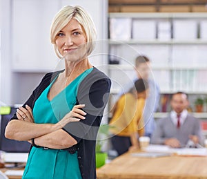 Businesswoman, arms crossed and portrait in office or workplace for presentation or meeting with confidence. Mature