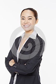 Businesswoman with arms crossed, smiling
