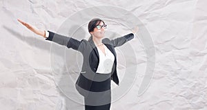 Businesswoman with arms raised outstretched