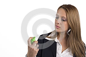 Businesswoman with asthma using inhaler