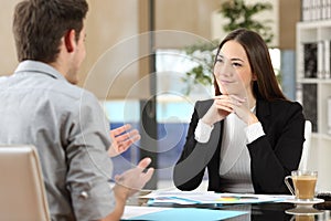 Businesswoman attending a client at office