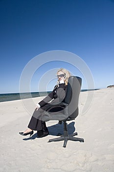 Businesswoman on beach