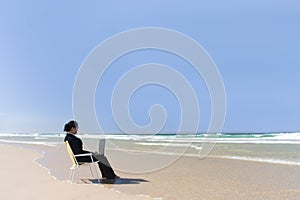 Businesswoman at beach