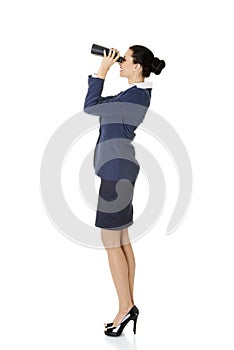 Businesswoman with binoculars.