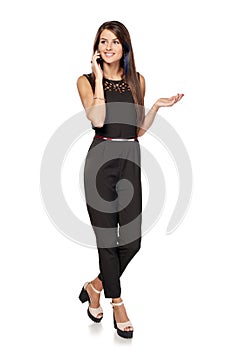 Businesswoman in black talking by the smartphone photo
