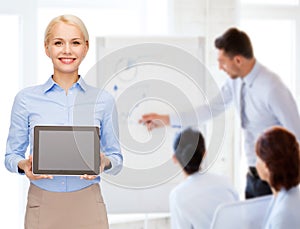 Businesswoman with blank black tablet pc screen