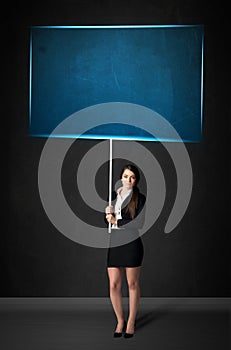 Businesswoman with blue board
