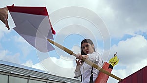 Businesswoman with a bow hit the bull`s-eye