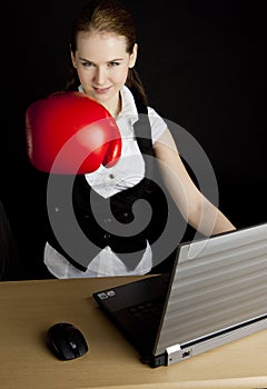 Businesswoman with boxing glove