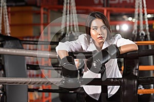 Businesswoman with boxing glove,Tiredness.